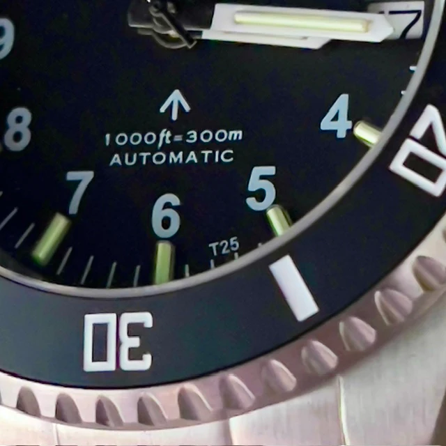 MWC 24 Jewel 300m Automatic Military Divers Watch with Tritium GTLS Illumination, Sapphire Crystal and Ceramic Bezel and Steel Bracelet - Image 17